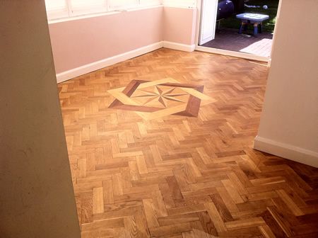 Rustic Oak Parquet Flooring With Marquetry insert Restored in Cheshire